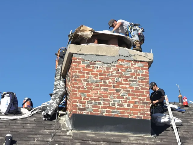 North Miami Chimney Sweep installing a custom chimney crown in North Miami, FL