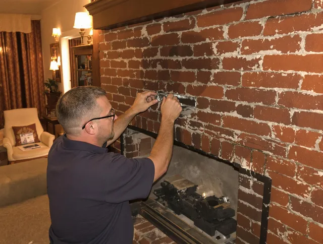 North Miami Chimney Sweep expert fixing a fireplace in North Miami, FL